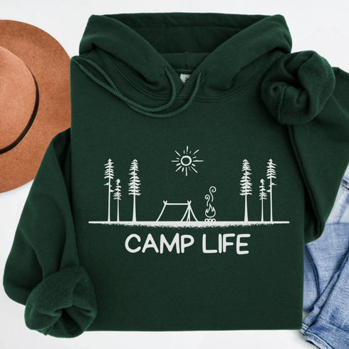 This hoodie Features a laid-back campsite logo, it’s made for folks who think burnt marshmallows are gourmet, tents are luxury suites, and every log is a potential chair.